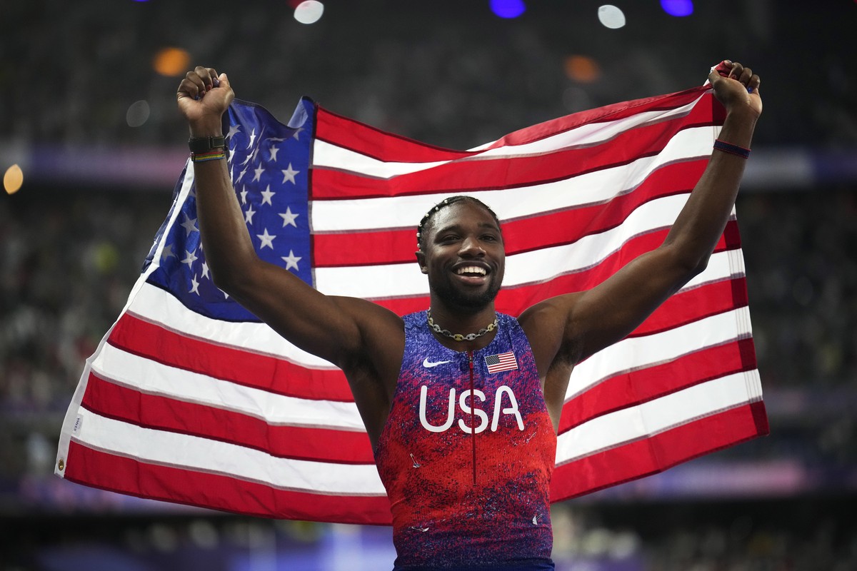 Noah Lyles, of the United States, celebrates after winning the men's 100-meter final at the 2024 Summer Olympics, Sunday, Aug. 4, 2024, in Saint-Denis, France. (AP Photo/Petr David Josek)