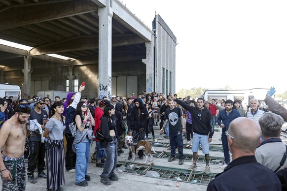 Police break up an illegal rave party in Modena, Italy, Oct. 31, 2022. 