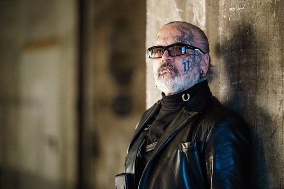 epa09827555 German photographer and doorman of Berlin's techno music club Berghain, Sven Marquardt poses for the photographer prior to a visit to the runway show of German designer Esther Perbandt at  ...