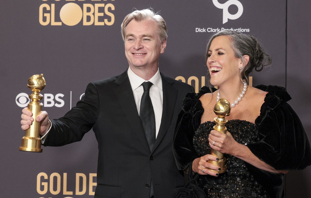 epa11063634 British director Christopher Nolan (L) and British film producer Emma Thomas (R) hold their Golden Globe awards for Best Director - Motion Picture and Best Motion Picture - Drama for ' ...