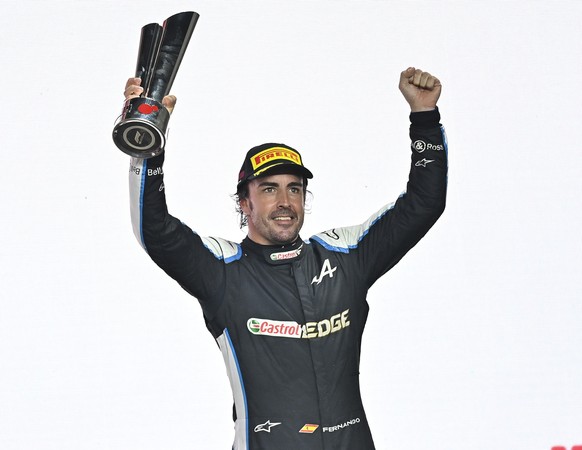 epa09596222 Spanish Formula One driver Fernando Alonso of Alpine F1 Team reacts on the podium after the 2021 Formula One Grand Prix of Qatar at the Lo?sail International Circuit in Lusail, Qatar, 21 N ...