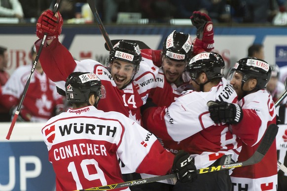 Team Canada&#039;s Cory Conacher, Trevor Carrick, Keaten Ellerby, Chris Didomenico and Derek Roy, from left, celebrate after scoring 1-1 during the final game between Team Canada and Switzerland&#039; ...