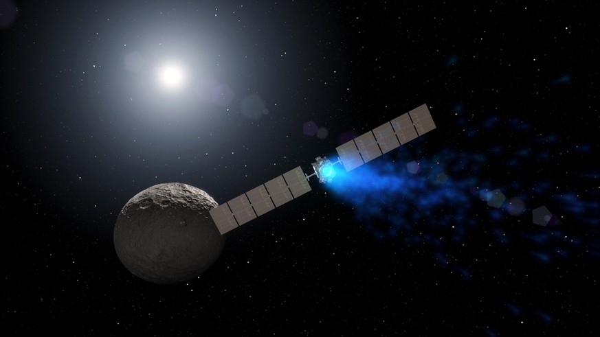 This artist rendering by NASA shows the Dawn spacecraft orbiting the dwarf planet Ceres. New findings presented at the American Geophysical Union meeting on Thursday, Dec. 15, 2016 show that ice can e ...
