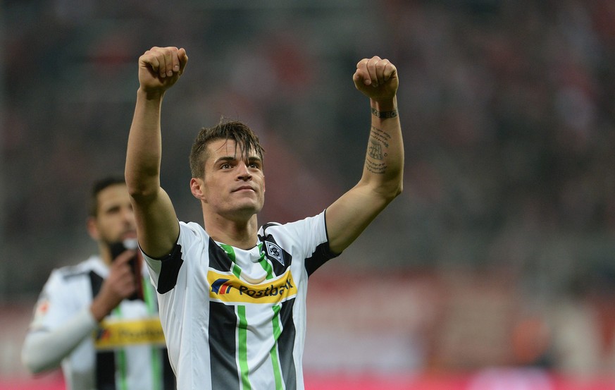 epa04675066 Granit Xhaka of Gladbach react after the German Bundesliga soccer match between FC Bayern Munich and Borussia Moenchengladbach in the Allianz Arena in Munich, Germany, 22 March 2015. Gladb ...