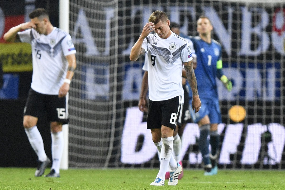 Germany's Toni Kroos reacts after the Netherland's second goal during the Euro 2020 group C qualifying soccer match between Germany and the Netherlands at the Volksparkstadion in Hamburg, Ge ...