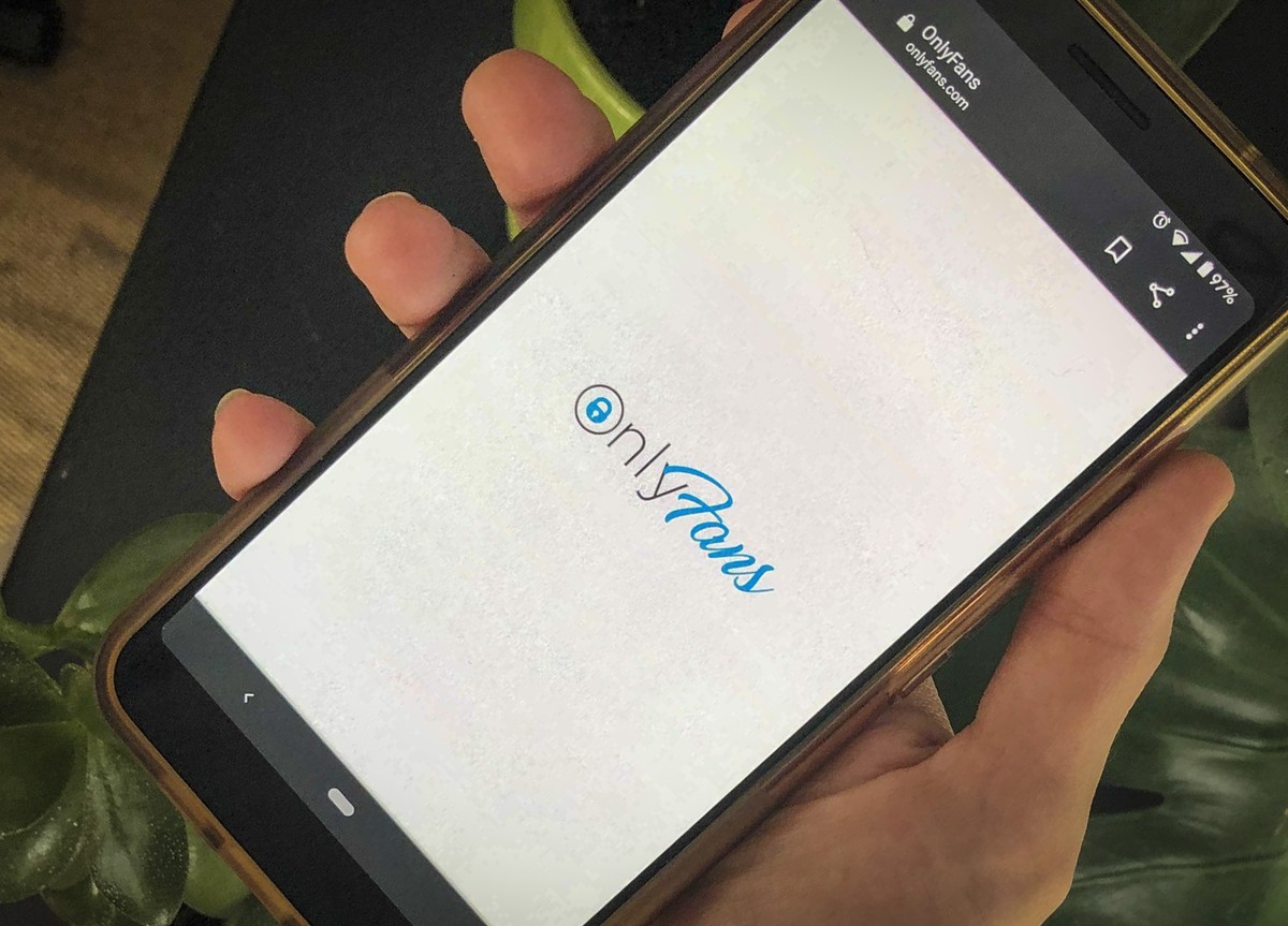 This photo shows a phone app for OnlyFans, a site where fans pay creators for their photos and videos, Thursday Aug. 19, 2021. A spokesperson says the site will ban "sexually explicit" start ...