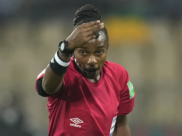 FILE - Referee Salima Mukansanga, of Rwanda, gestures towards the players during the African Cup of Nations 2022 group B soccer match between Zimbabwe and Guinea at the Ahmadou Ahidjo stadium in Yaoun ...