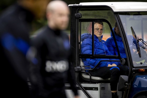 epa09583072 National coach Louis van Gaal (L) drives in a cart with captian Virgil van Dijk (R) during a training session of the Dutch national team at the KNVB Campus in Zeist, the Netherlands, 15 No ...