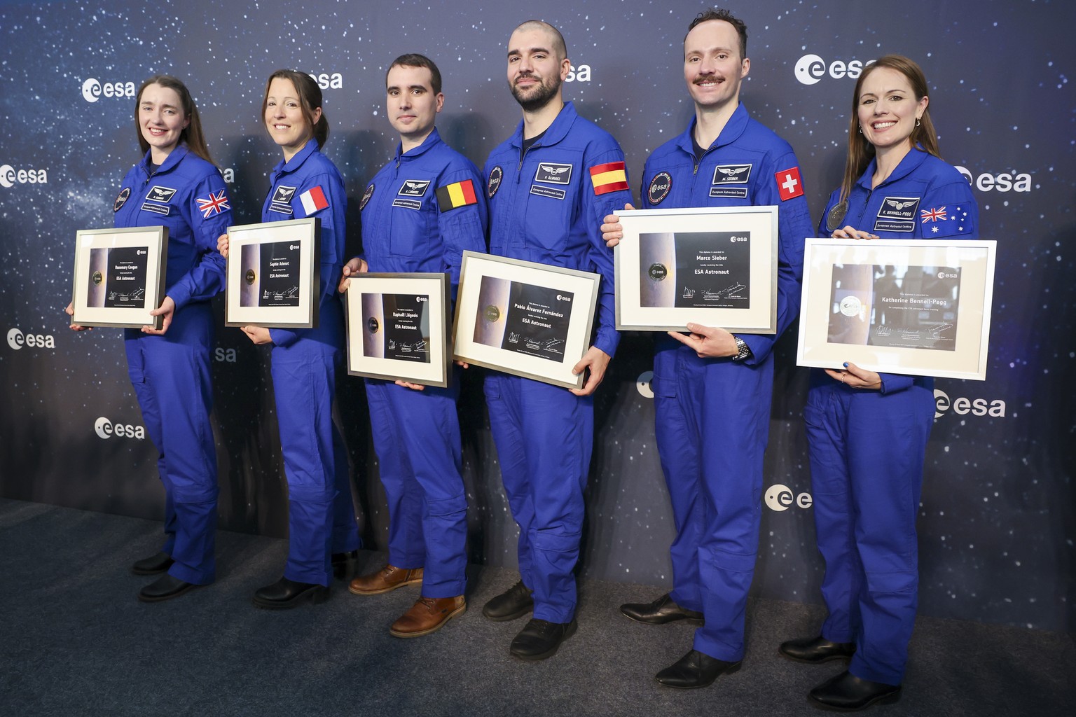epa11293531 European Space Agency astronaut graduates (L-R) Rosemary Coogan, Sophie Adenot, Raphael Liegeois, Pablo Alvarez Fernandez and Marco Sieber, as well as Australia&#039;s Katherine Bennell-Pe ...