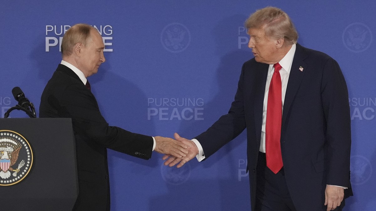 FILE - President Donald Trump, right, shakes the hand of Russia's President Vladimir Putin during a joint press conference at Joint Base Elmendorf-Richardson, Alaska, Aug. 15, 2025. (AP Photo/Jae ...