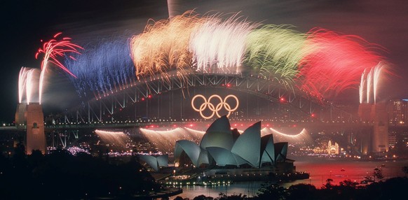 FILE - In this Oct. 1, 2000, file photo, the closing ceremony fireworks for the Sydney 2000 Olympic Games erupt over the Sydney Harbor Bridge and Opera House in Australia. An Australian push to host t ...