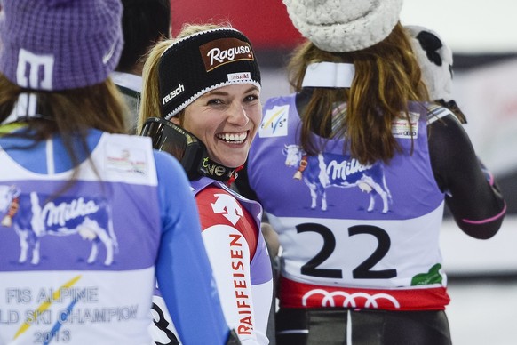 Lara Gut of Switzerland, silver medal winner, center, celebrates on the podium, during the flowers ceremony after the Women's Super-G race at the FIS Alpine Skiing World Championships in Schladmi ...