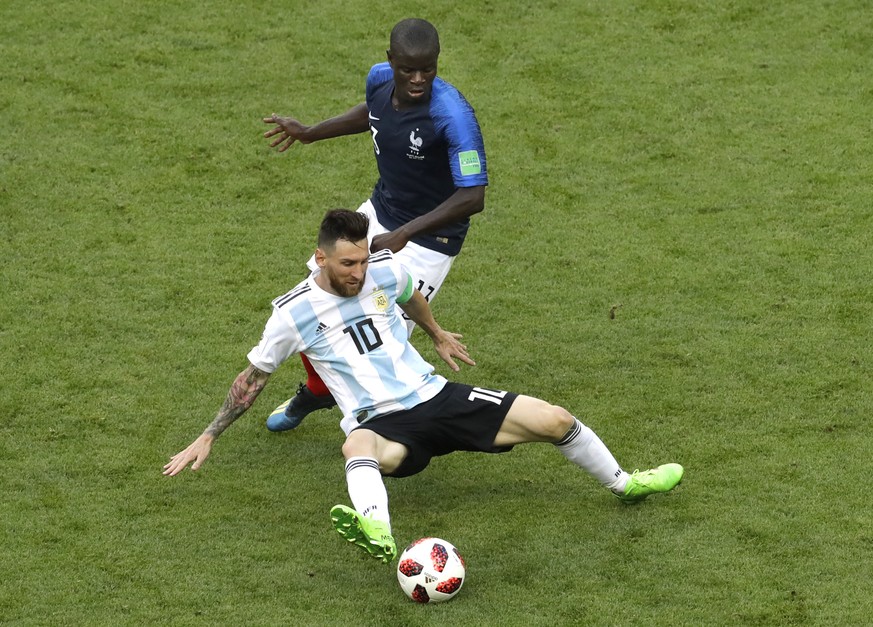 France&#039;s Ngolo Kante, back, and Argentina&#039;s Lionel Messi challenge for the ball during the round of 16 match between France and Argentina, at the 2018 soccer World Cup at the Kazan Arena in  ...