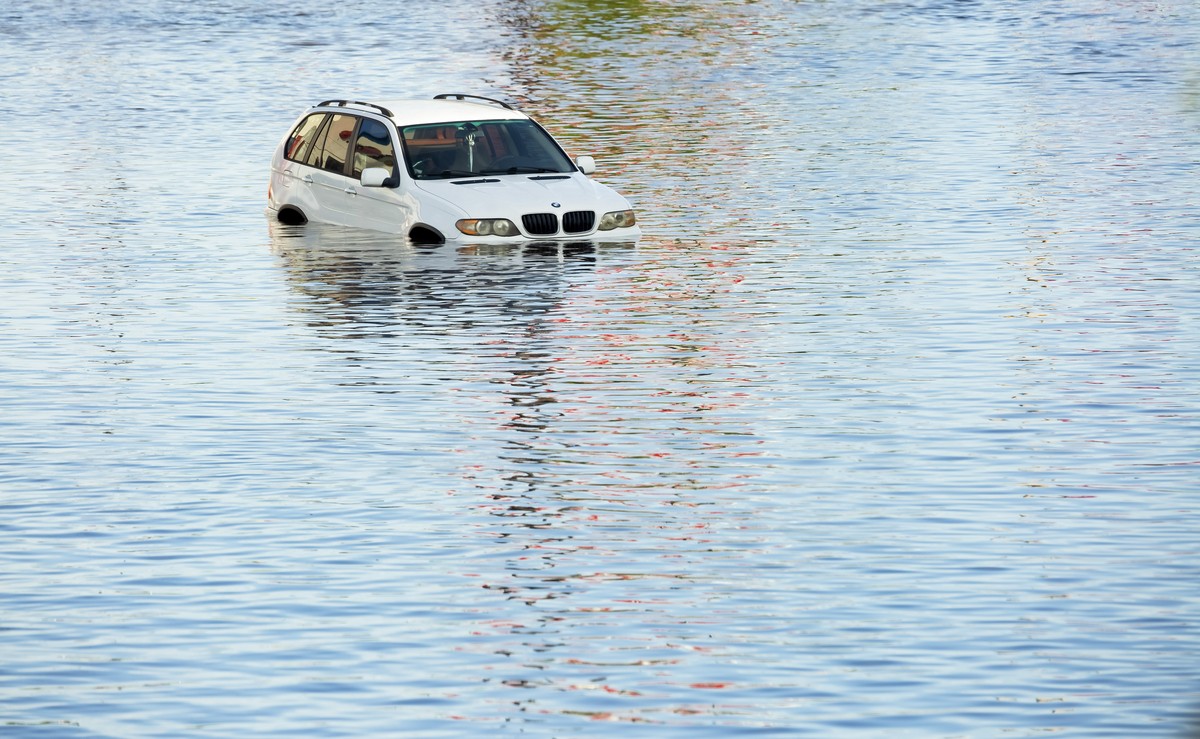 epa11467569 A vehicle trapped in flood waters following heavy rain from Hurricane Beryl in Houston, Texas, USA, 08 July 2024. The storm, which already caused widespread damage last week in the Caribbe ...