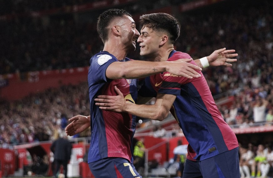 Copa del Rey - Real Madrid vs Barcelona SEVILLA, SPAIN - April 26:Ferran Torres of Barcelona and Pedri Gonzalez of Barcelona celebrates a goal during the 2024/25 Copa del Rey final match between Real  ...