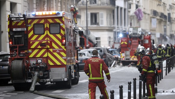 Firefighters work at the scene of a gas leak explosion in Paris, France, Saturday, Jan. 12, 2019. Paris police say several people have been injured in an explosion and fire at a bakery believed caused ...