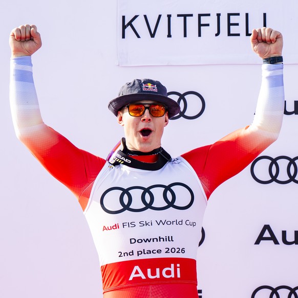 Franjo von Allmen of Switzerland, left, second placed of the men's Downhill overall ranking and Marco Odermatt of Switzerland, right, winner of the men's Downhill overall leader crystal glob ...