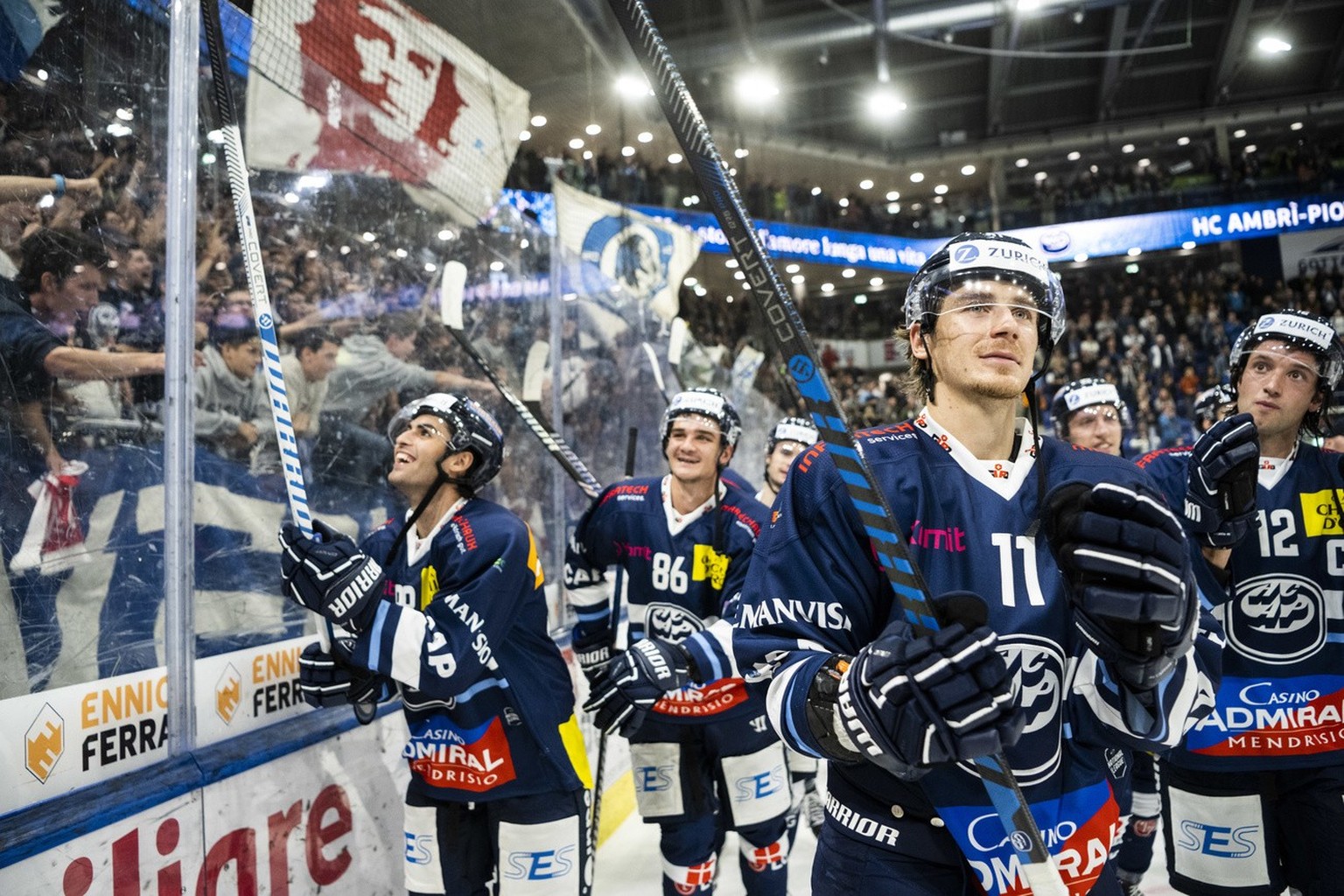 Ambri&#039;s player Johnny Kneubuehler celebrates the victory with teammates after the regular season National League match between HC Ambri Piotta and Lausanne HC, at the Gottardo Arena in Ambri, on  ...