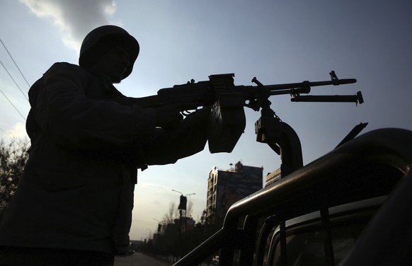 FILE - In this March 6, 2020, filer photo, an Afghan security personnel stand guard after an attack in Kabul, Afghanistan. he U.N. mission in Afghanistan report released on Monday, July 27, 2020, has  ...