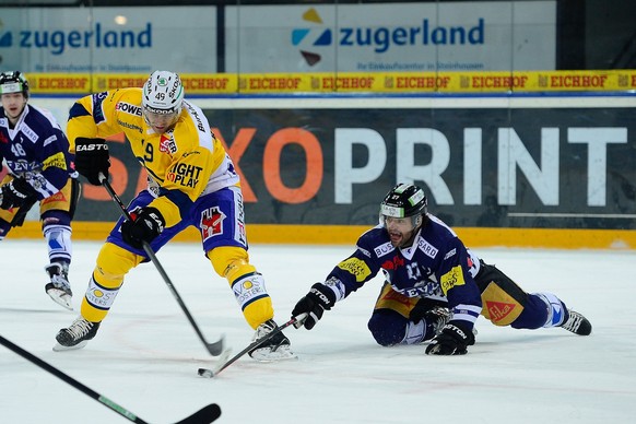 05.03.2015; Zug; Eishockey NLA Playoff EV Zug - HC Davos; Tyler Redenbach (Davos) gegen Josh Holden (Zug) (Daniela Frutiger/Freshfocus)