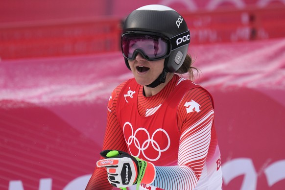 Priska Nufer of Switzerland reacts after finishing women&#039;s downhill training at the 2022 Winter Olympics, Saturday, Feb. 12, 2022, in the Yanqing district of Beijing. (AP Photo/Luca Bruno)