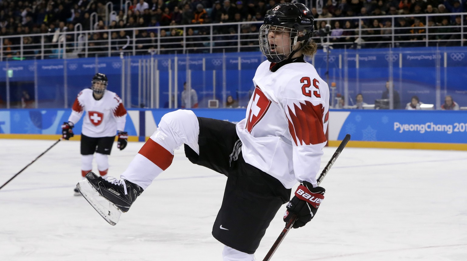 Alina Muller (25), of Switzerland, celebrates after scoring a goal against Sweden during the second period of the preliminary round of the women&#039;s hockey game at the 2018 Winter Olympics in Gangn ...