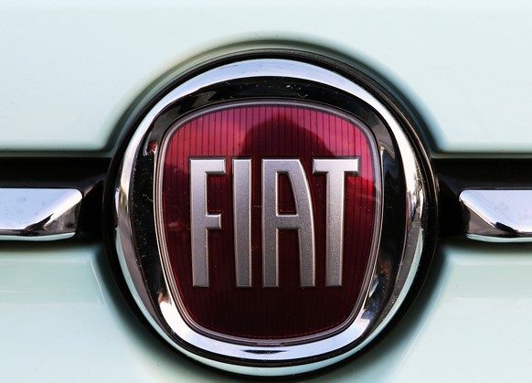 FILE - In this Oct. 31, 2019 file photo, a Fiat logo is pictured on a car in Bayonne, southwestern France. Fiat Chrysler Automobiles and PSA Peugeot announced Wednesday, Dec. 18, 2019, that their boar ...