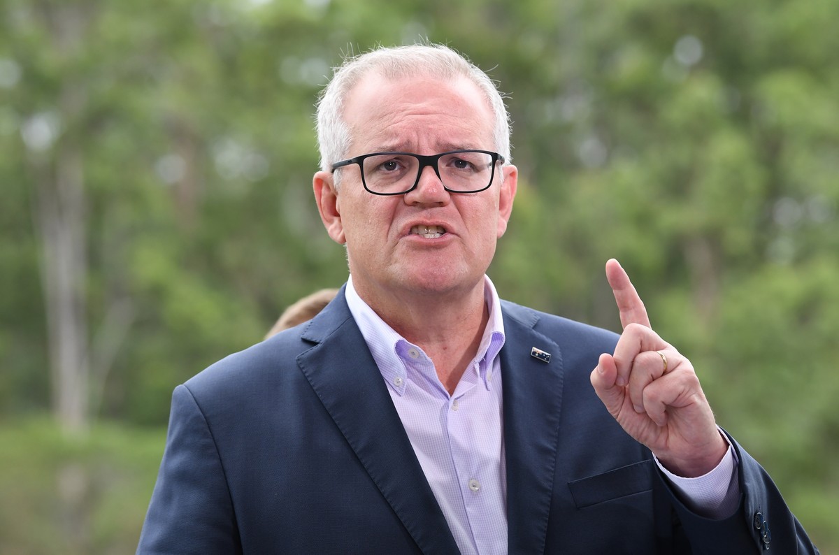 epa09813862 Prime Minister Scott Morrison speaks during a press conference at Gallipoli Barracks in Brisbane, Australia, 10 March 2022. Prime Minister Morrison will make a formal request for a nationa ...