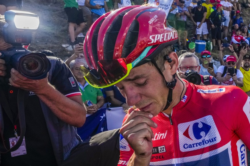 Belgian Remco Evenepoel of Quick-Step Alpha Vinyl, red shirt leader of La Vuelta reacts at the end of the 20th stage of the Vuelta cycling race between Moralzalzar to Puerto Navacerrada, Spain, Saturd ...