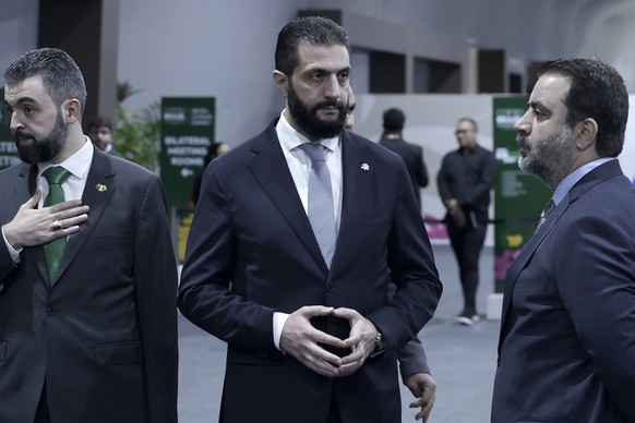 epa12509560 Syrian President Ahmed Al Sharaa (C) attends the opening of the COP30 leaders&#039; summit at the Hangar Convention Center in Belem, Brazil, 06 November 2025. The COP30 Leaders&#039; Summi ...