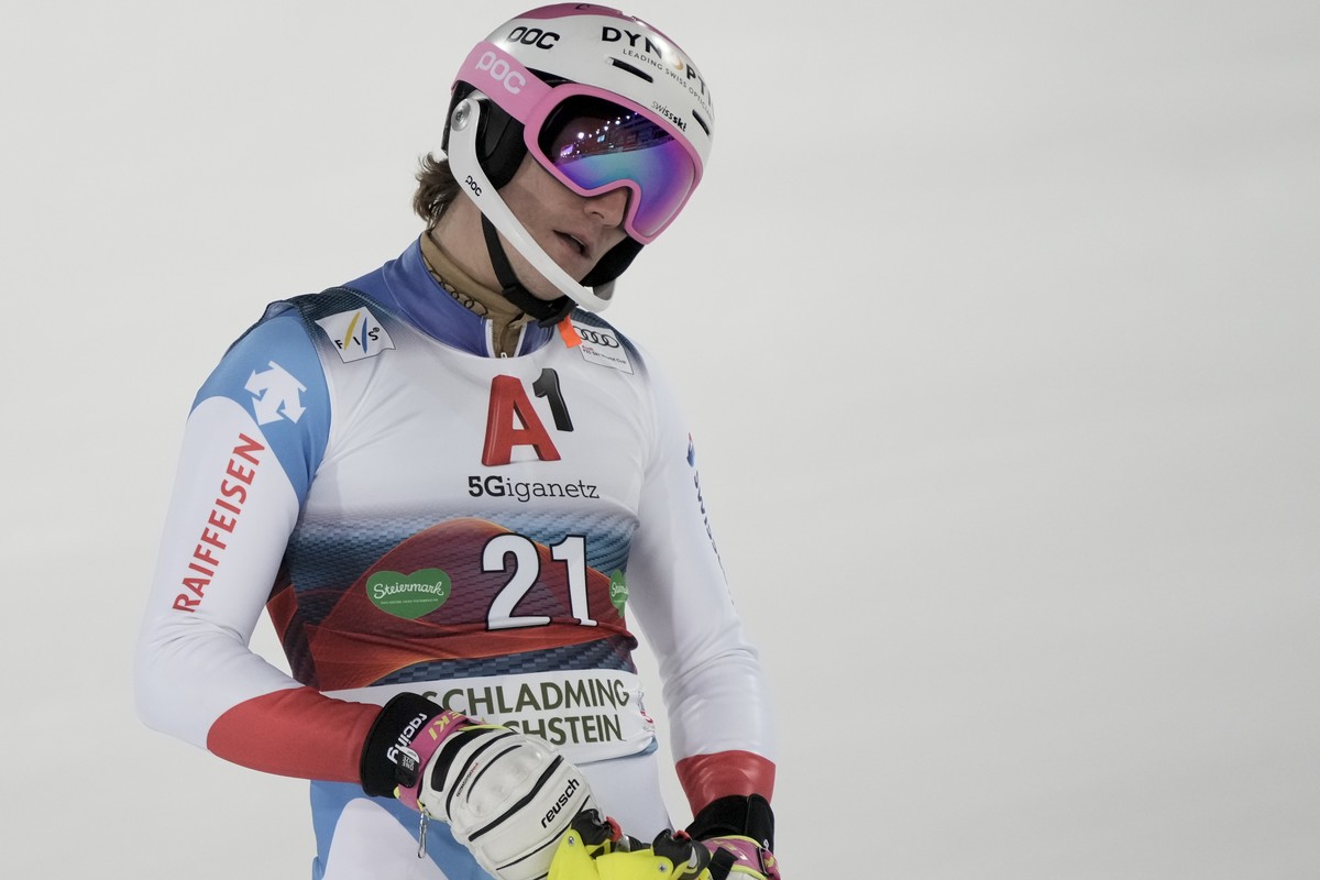 Switzerland's Tanguy Nef reacts in the finish area after completing an alpine ski, men's World Cup slalom, in Schladming, Austria, Tuesday, Jan. 25, 2022. (AP Photo/Giovanni Auletta)
