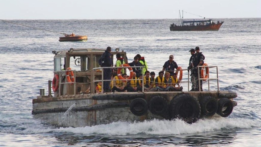 epa05609194 A picture made available on 30 October 2016 shows a boat carrying asylum seekers arriving at Christmas Island, Australia, 28 June 2012. The federal government announced on 30 October 2016  ...