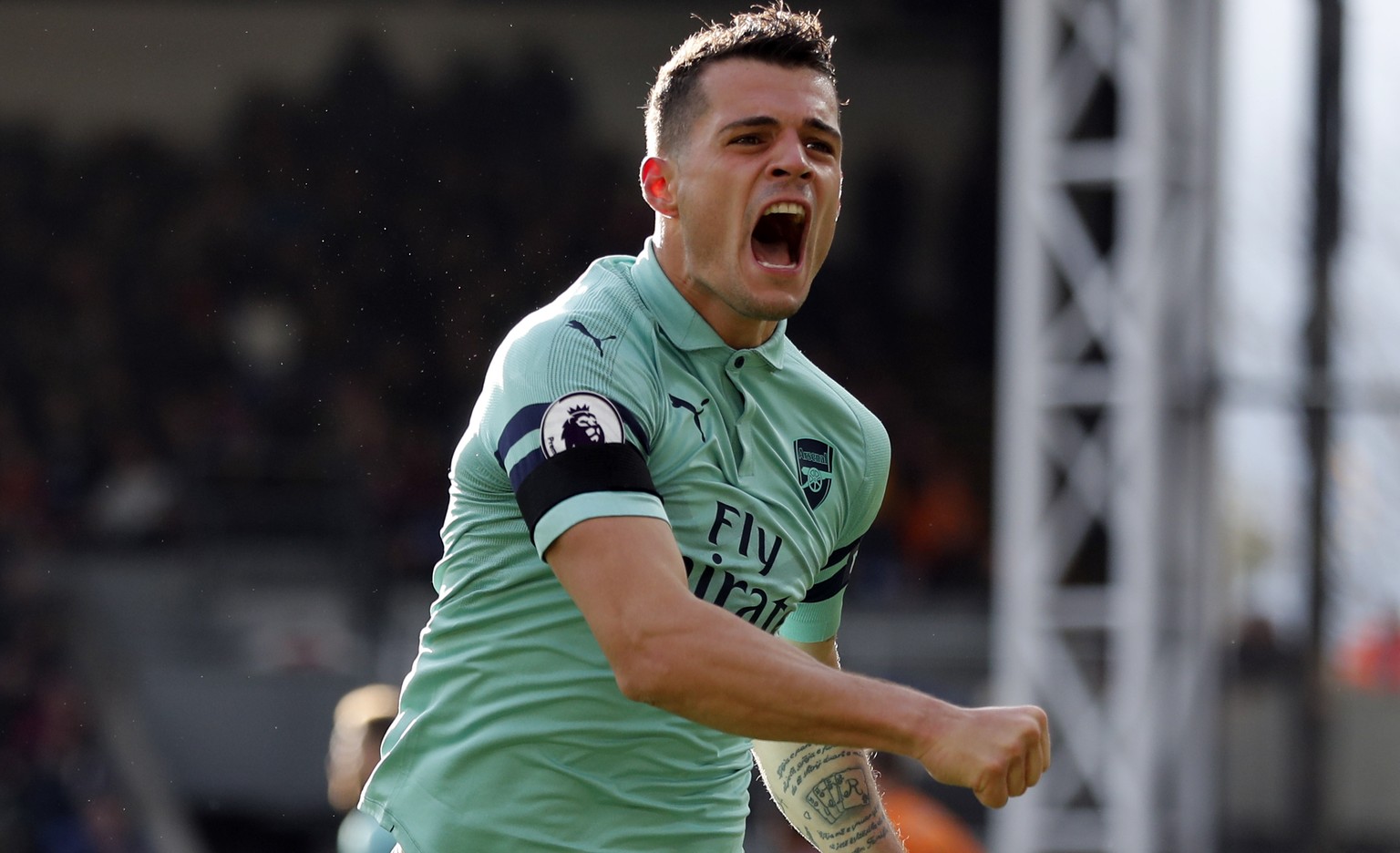 Arsenal&#039;s Granit Xhaka celebrates after scoring his side&#039;s first goal of the game during the English Premier League soccer match between Crystal Palace and Arsenal at Selhurst Park, London,  ...