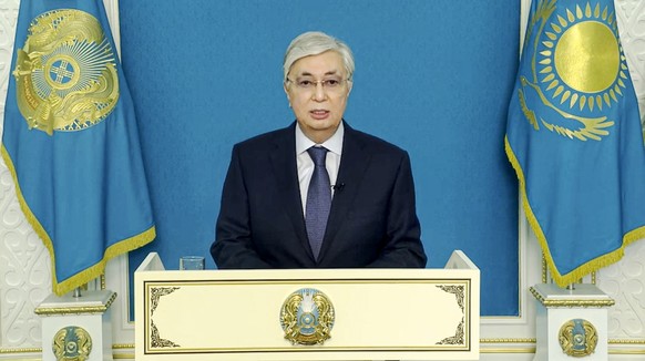 In this handout photo taken from video released by Kazakhstan&#039;s Presidential Press Service, Kazakhstan&#039;s President Kassym-Jomart Tokayev speaks during his televised statement to the nation i ...