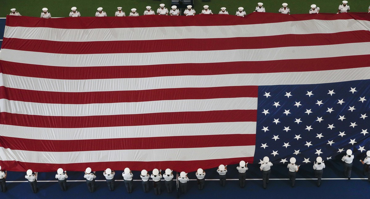 West Point cadets hold the flag over the court before the women's finals between Serena Williams and Naomi Osaka, of Japan, at the U.S. Open tennis tournament, Saturday, Sept. 8, 2018, in New Yor ...