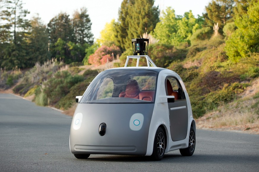 epa04230358 A handout photo released by Google on 28 May 2014 showing their latest prototype self-driving vehicle in Mountain View, California, USA, 28 May 2014. Google reports that they plan to build ...