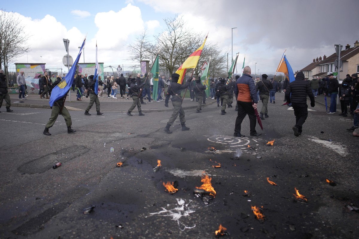 The remains of petrol bombs on the ground as Republican protesters opposed to the Good Friday Agreement take part in a parade in Londonderry, Northern Ireland,Monday, April 10, 2023. President Biden i ...