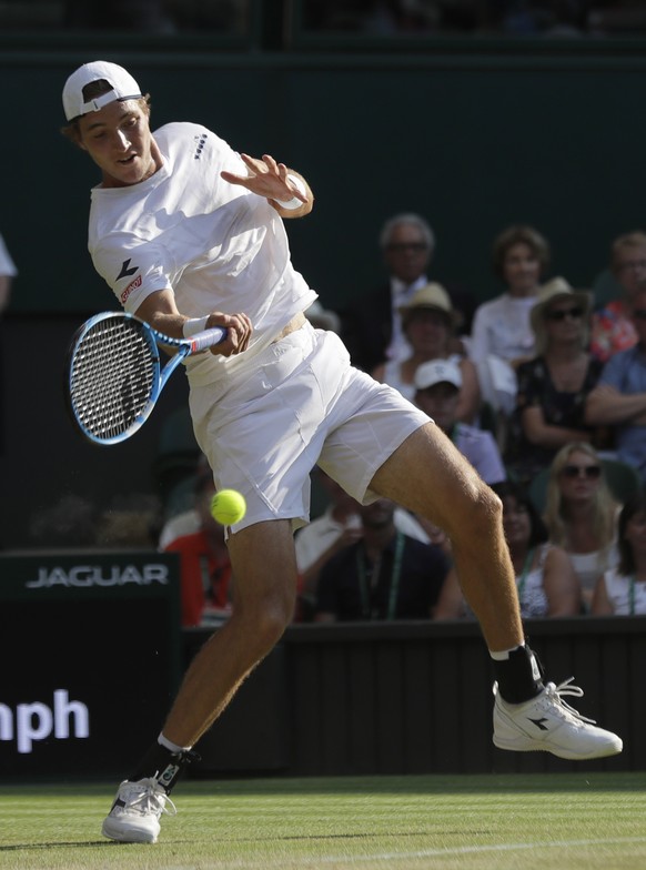 Germany&#039;s Jan-Lennard Struff returns the ball to Switzerland&#039;s Roger Federer during their men&#039;s singles match, on the fifth day of the Wimbledon Tennis Championships in London, Friday J ...