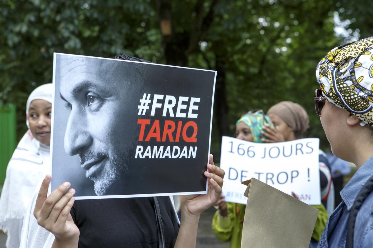 Women hold placards with writing "Free Tariq Ramadan" and "166 days too much!", during a rally in support of Islamic scholar Tariq Ramadan next to French consulate, in Geneva, Swit ...