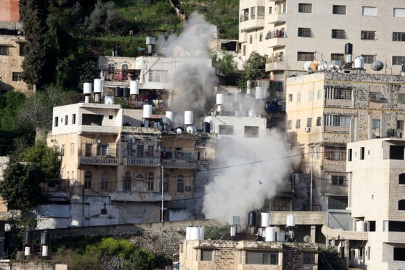 epa12855960 Smoke rises after Israeli forces demolished a house in Nablus, the West Bank, 28 March 2026. Israeli troops entered Nablus and encircled the home of the family of slain Palestinian Mahmoud ...