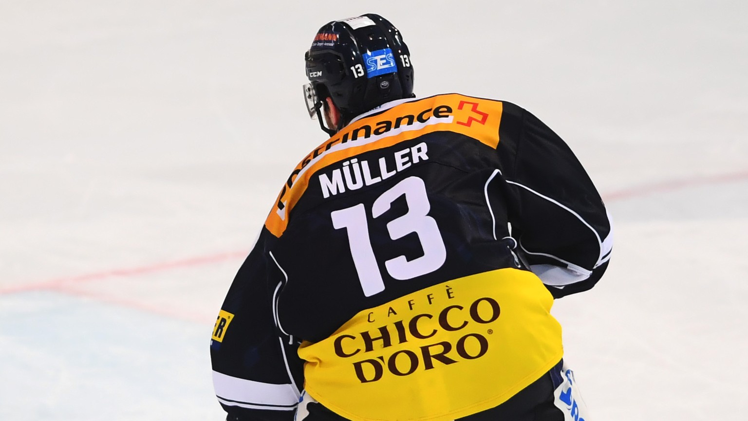 Ambri&#039;s player Marco Mueller, right, scores a penalty shot against Lugano&#039;s goalkeeper Elvis Merzlikins, left, during the regular season game of the National League Swiss Championship 2018/1 ...