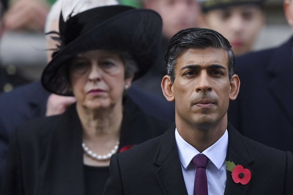 British Prime Minister Rishi Sunak and former Prime Minister Theresa May attend the Remembrance Sunday ceremony at the Cenotaph on Whitehall in London, Sunday Nov. 13, 2022. (Toby Melville/Pool via AP ...