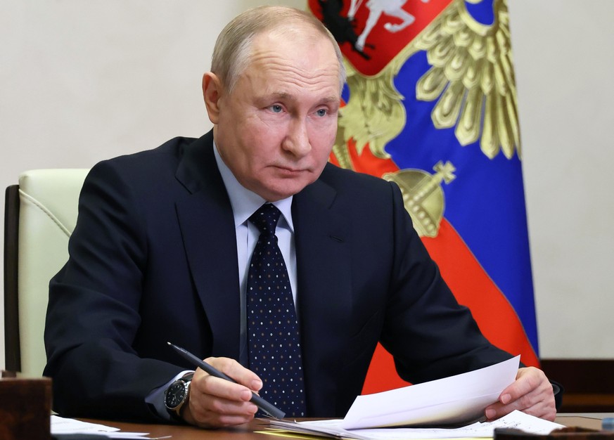 Russian President Vladimir Putin chairs a cabinet meeting via videoconference at the Novo-Ogaryovo state residence, outside Moscow, Russia, Tuesday, Jan. 24, 2023. (Mikhail Klimentyev, Sputnik, Kremli ...