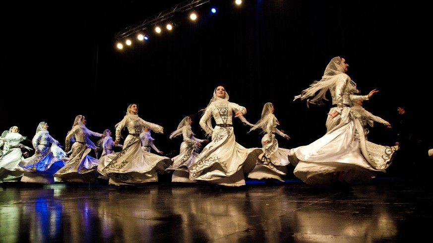 AMMAN - MARCH 15: Female dancers from Chechnya Wainakh ensemble performing for Jordanian Audience and royal family, during Kadyrov&#039;s visit to Jordan. March 15, 2011 in Amman, Jordan.