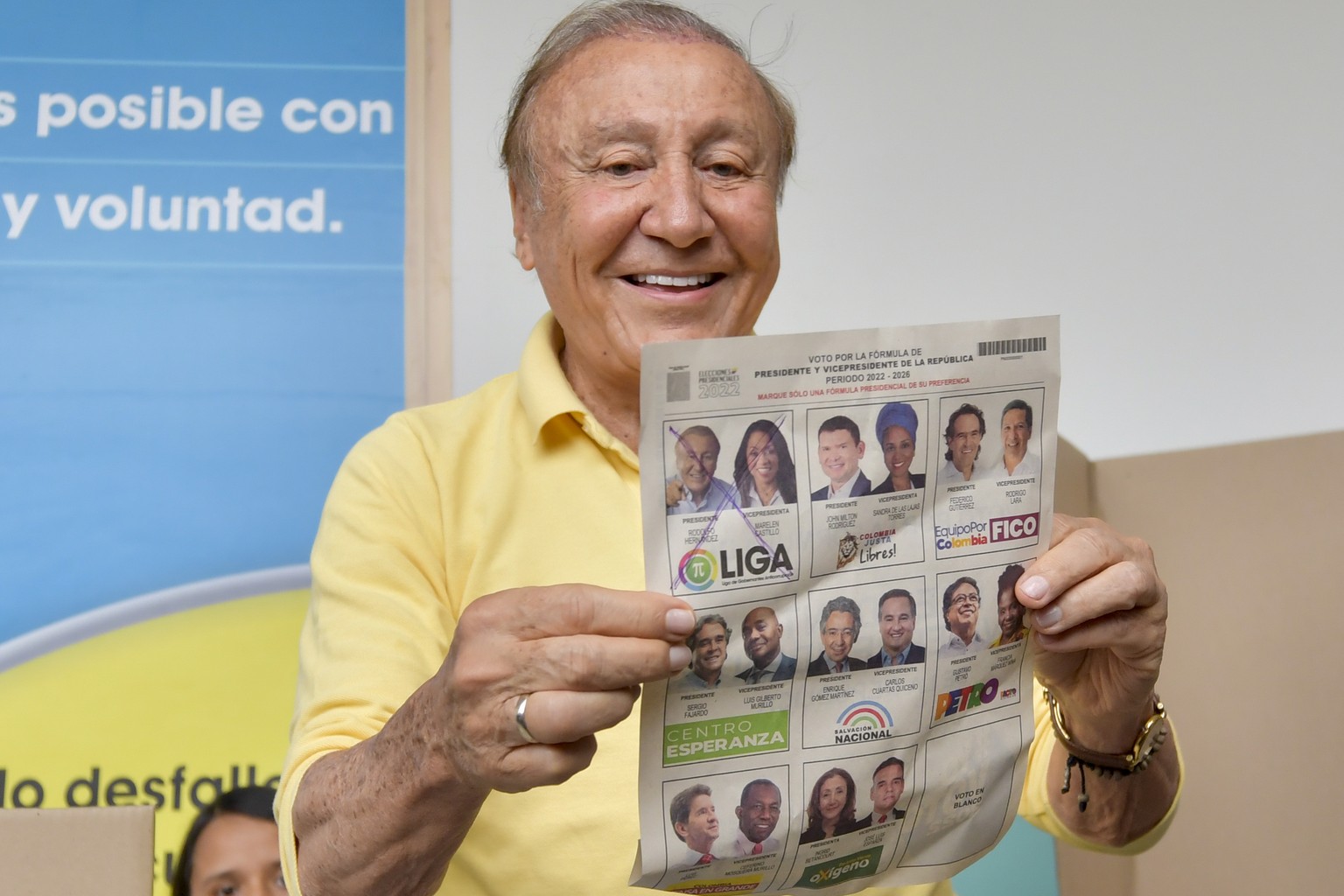 Rodolfo Hernandez, presidential candidate with the Anti-corruption Governors League, shows his ballot before voting in presidential elections in Bucaramanga, Colombia, Sunday, May 29, 2022. (AP Photo/ ...