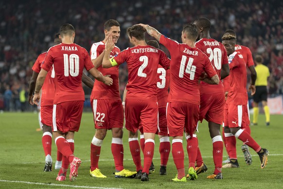 Switzerland&#039;s players cheer during the 2018 Fifa World Cup Russia group B qualification soccer match between Switzerland and Hungary in the St. Jakob-Park stadium in Basel, Switzerland, on Saturd ...