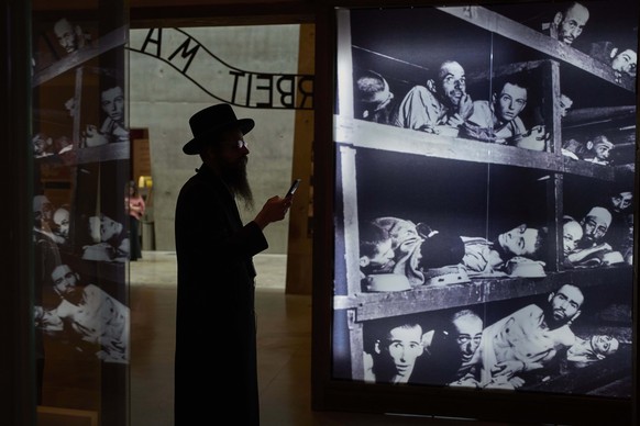 An ultra-Orthodox Jewish man visit the Yad Vashem Holocaust Memorial Museum in Jerusalem, Tuesday, April 22, 2025, ahead of the annual Holocaust remembrance day which begins at sundown Wednesday. (AP  ...