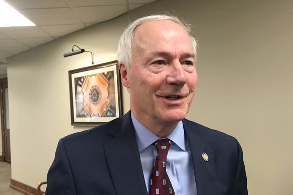 FILE - In this Jan. 13, 2020, file photo, Arkansas Gov. Asa Hutchinson speaks to reporters in Little Rock, Ark. Hutchinson on Tuesday, March 9, 2021, signed into law legislation banning nearly all abo ...