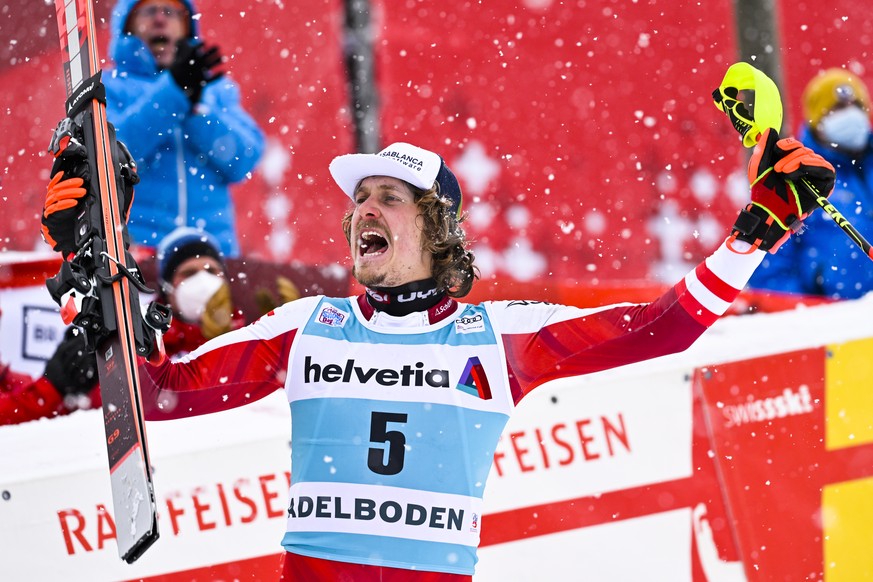epa09675505 Second placed Manuel Feller of Austria celebrates on the podium for the Men&#039;s Slalom race at the FIS Alpine Skiing World Cup in Adelboden, Switzerland, 09 January 2022. EPA/JEAN-CHRIS ...