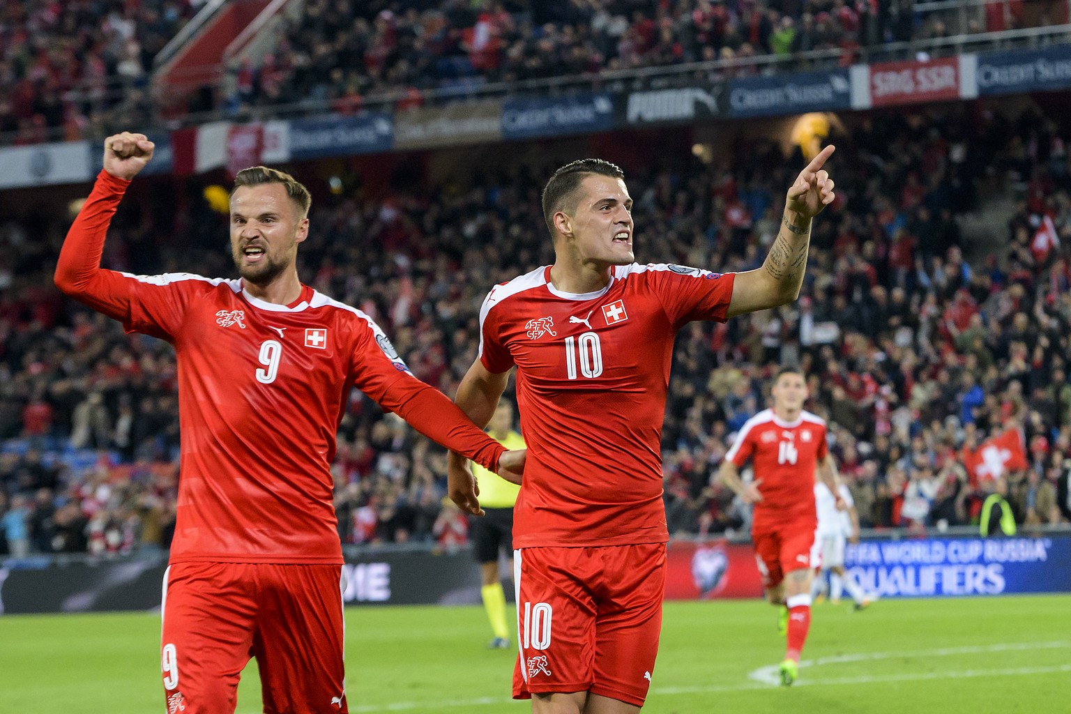 Switzerland&#039;s Granit Xhaka, right, celebrates after scoring the 1:0 with Switzerland&#039;s Haris Seferovic, left, during the 2018 Fifa World Cup Russia group B qualification soccer match between ...